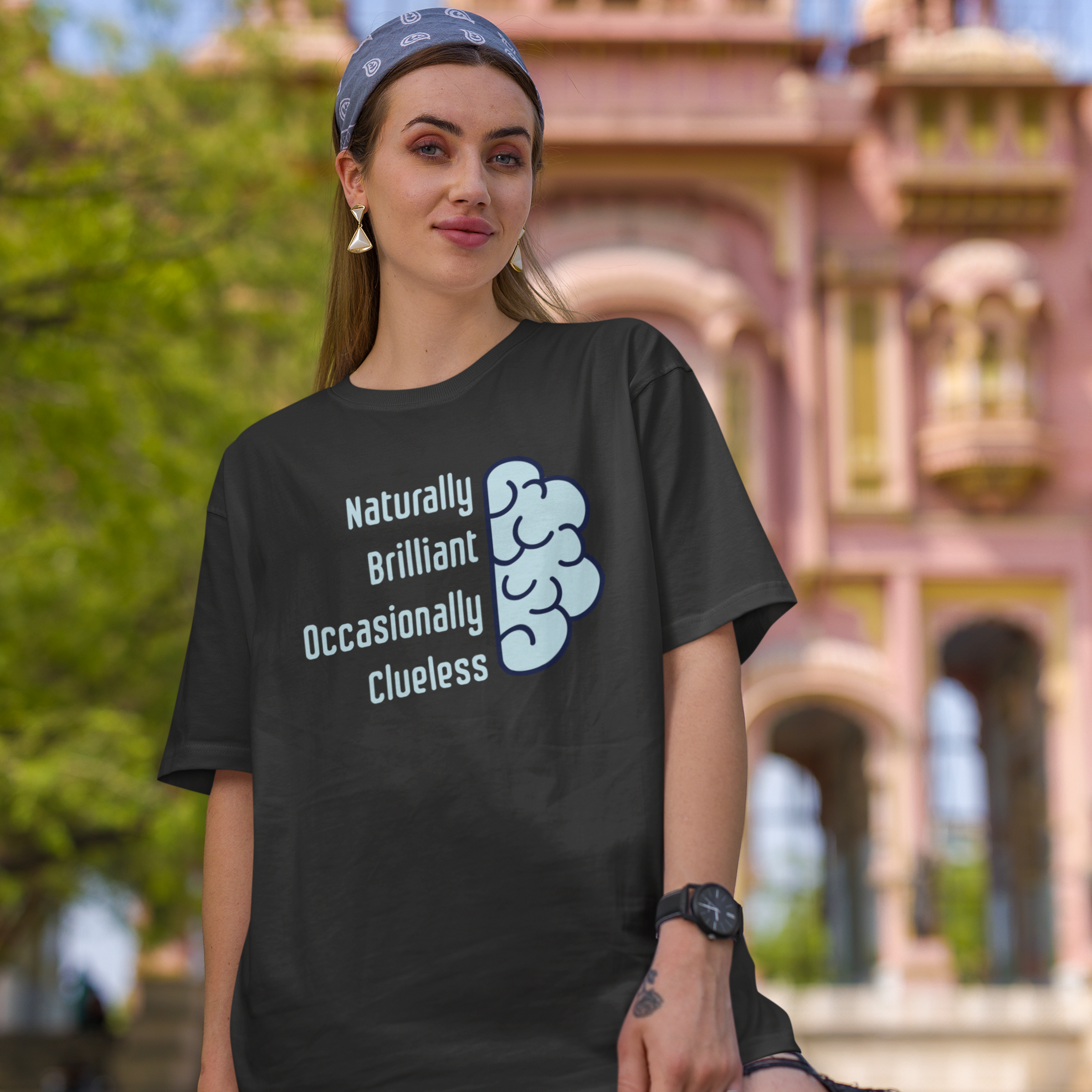'Naturally Brilliant Occasionally Clueless' Women's Oversized Cotton T-Shirt