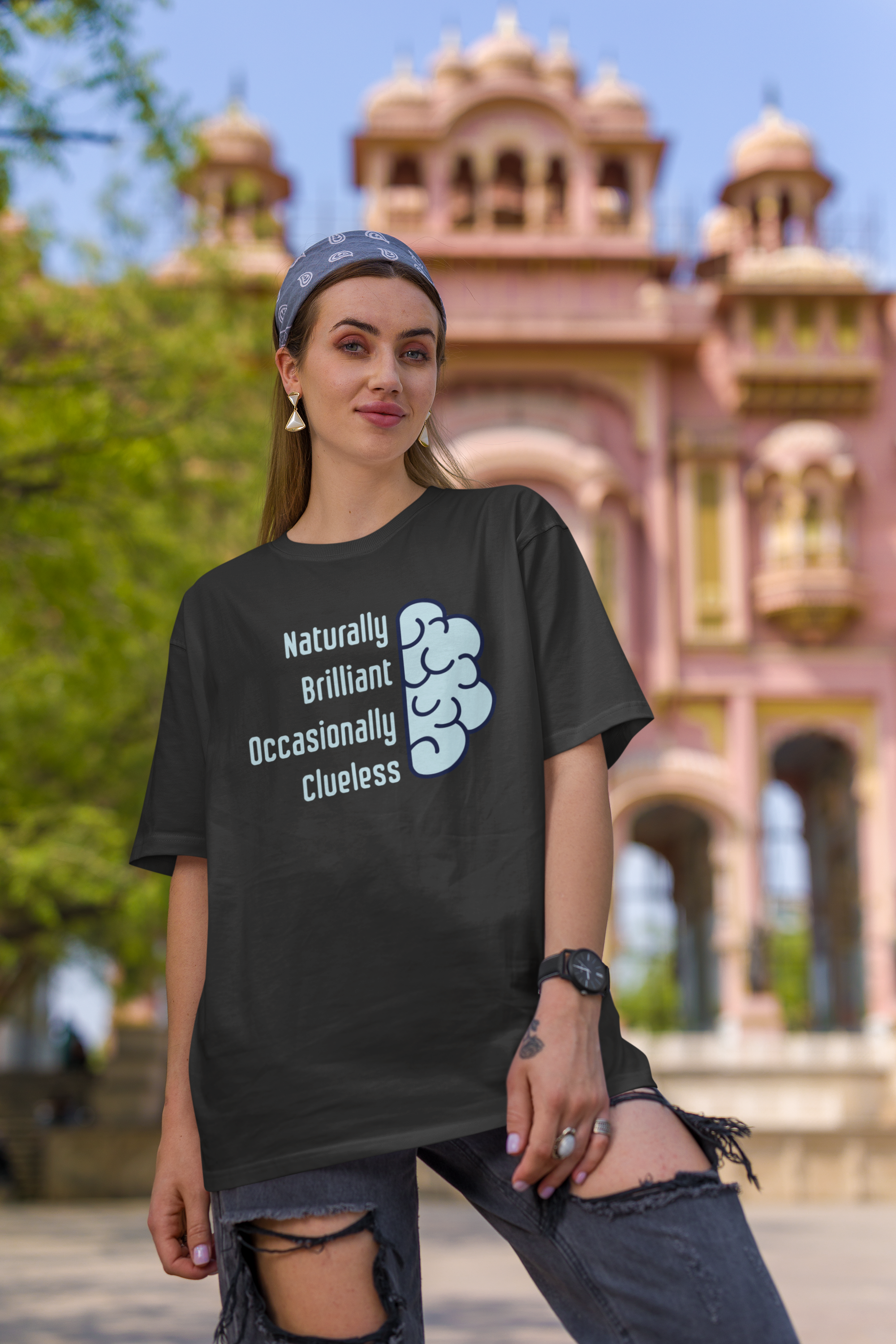 'Naturally Brilliant Occasionally Clueless' Women's Oversized Cotton T-Shirt